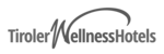 Logo von Tiroler Wellness Hotels in grauer Schrift mit geschwungenem N